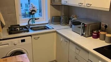 Fridge, microwave, oven, cookware/dishes/utensils