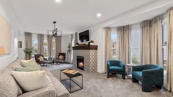 Smart TV, fireplace, table football, books