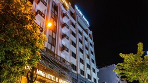 A hotel with a sign reading "Minh Hotel & Apartment" and "Chau Minh Hotel." - CM Hotel & Apartment (Hai Phong)