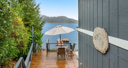 Sprawling lakefront property with kayaks, large deck, game table, & fireplace