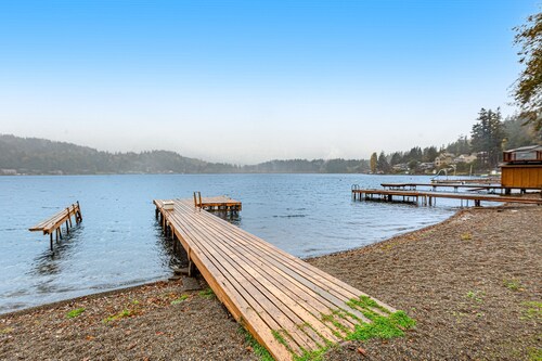 Sprawling lakefront property with kayaks, large deck, game table, & fireplace