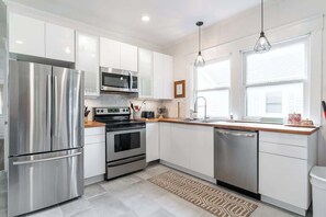 Fridge, microwave, oven, stovetop - Historic Pet-Friendly Home in Downtown (Indianapolis)