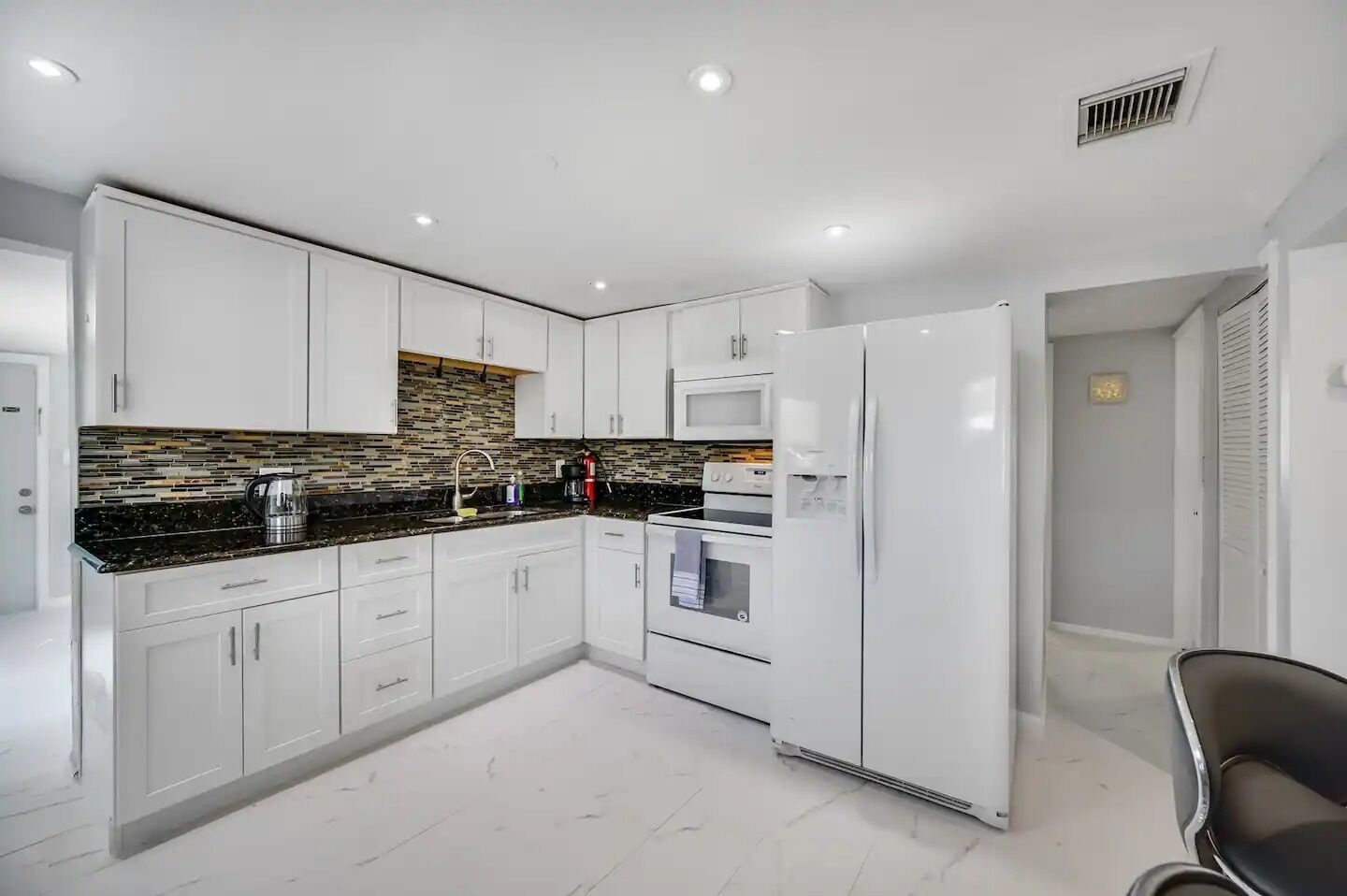 Fridge, stovetop, coffee/tea maker, cookware/dishes/utensils