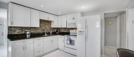 Fridge, stovetop, coffee/tea maker, cookware/dishes/utensils