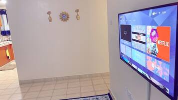Business Apartment | Living area | 24-inch Smart TV with digital channels