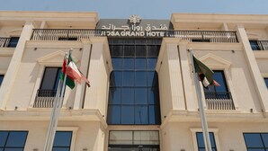The facade of the ROYAL ROYAL GRAND HOTEL with a clear view of the entrance and flagpoles. - Rosa Grand Hotel Monsieh (Riyadh)