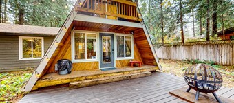 Dog-friendly A-frame near the river with game room, firepit, wood stove, & grill