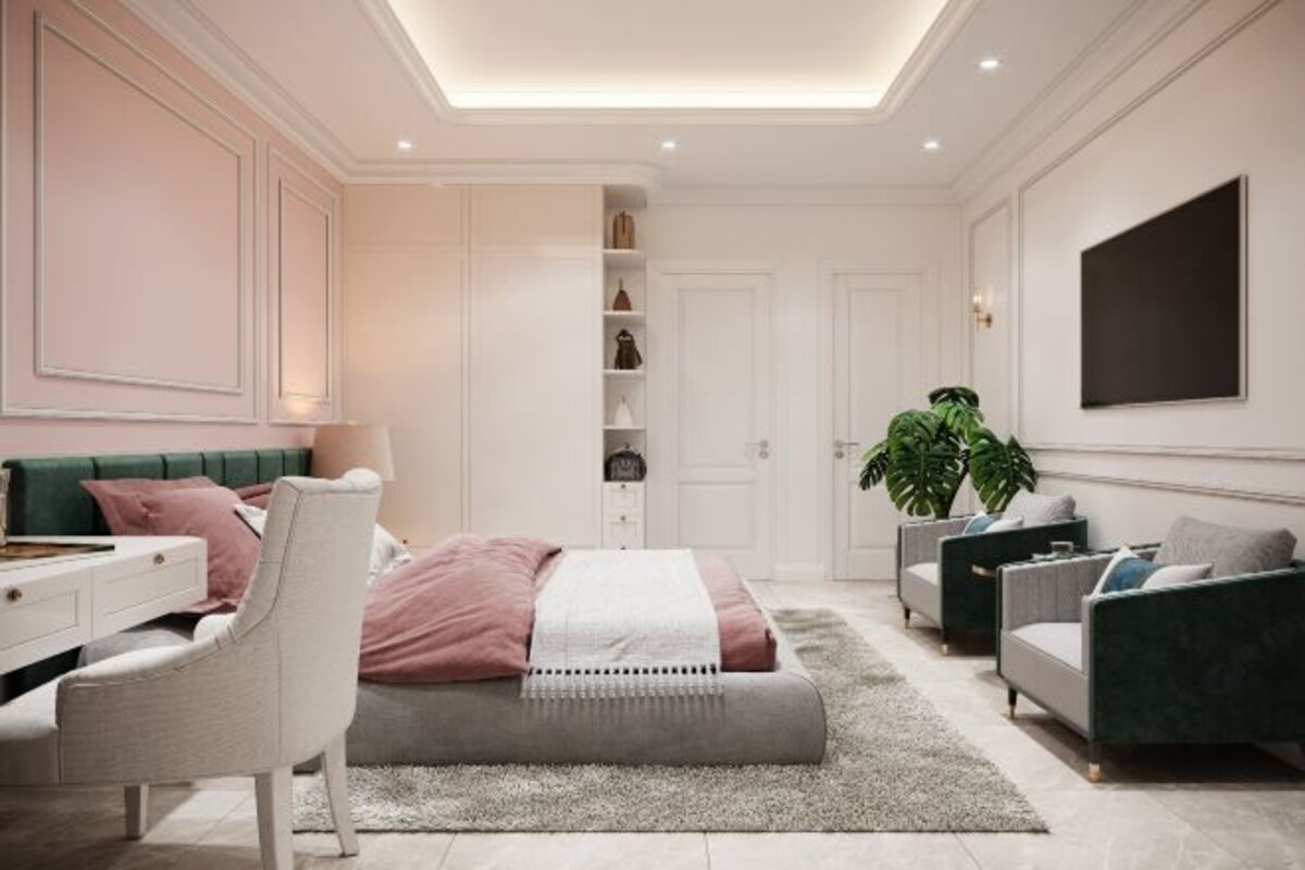 Une chambre à coucher moderne avec un lit, des tables de chevet, un bureau et un canapé vert.