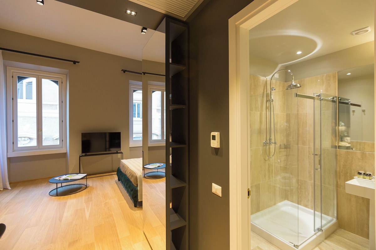 Bathroom | Shower, rainfall showerhead, hair dryer, bathrobes