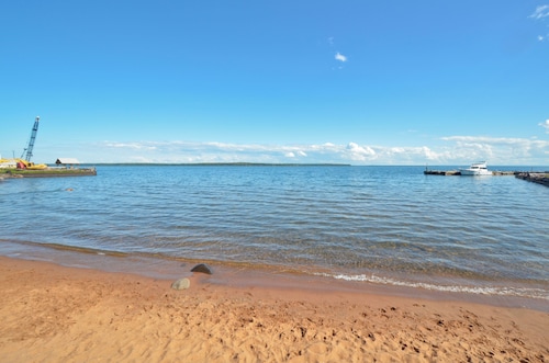 Modern Beach Front Condo with Lake Views