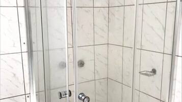 Shower, towels, toilet paper