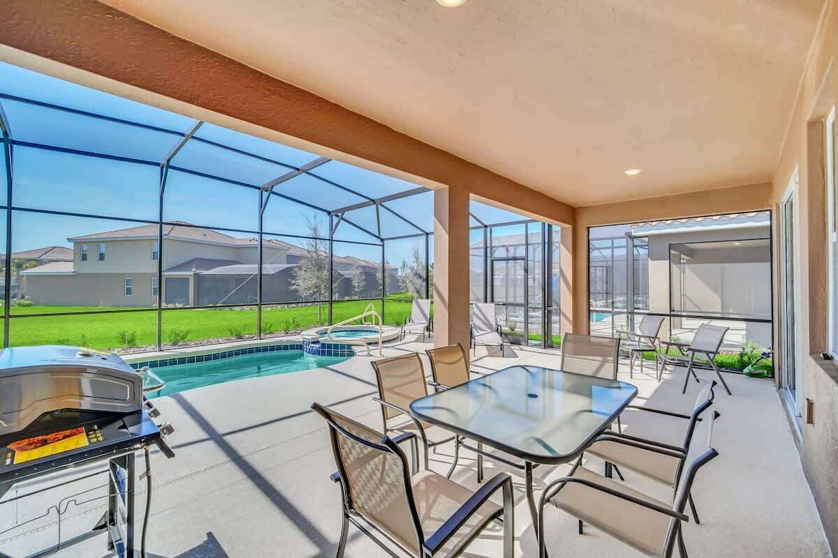 Enjoy a sunny day on your private screened patio with a pool, hot tub, and BBQ grill—perfect for entertaining.