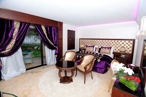 Deluxe Suite | 1 bedroom, premium bedding, in-room safe, individually decorated