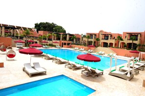 Indoor pool, outdoor pool, pool umbrellas, pool loungers
