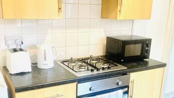 Fridge, microwave, electric kettle, cookware/dishes/utensils