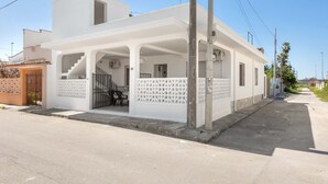 A white two-story house with a covered porch and a staircase. - 3311 Bianca House by Barbarhouse (Squinzano)