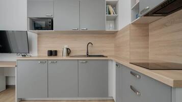 Fridge, microwave, stovetop, coffee/tea maker