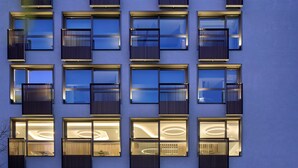 A modern building with multiple balconies, large windows, and a visible air conditioning unit labeled "FLAVOR SPOT". - Twinn Downtown Piraeus (Piraeus)