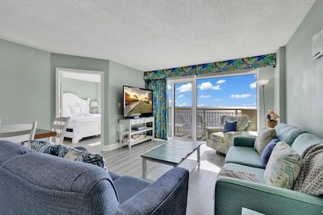 Signature Condo, 3 Bedrooms, Balcony, Ocean View | Living room | 65-inch Smart TV with cable channels