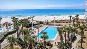 A resort with a pool, beach, and ocean view. - Gulf-front retreat with 3 pools, patio, and beach access! (Orange Beach)