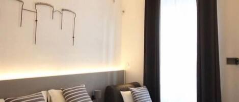 Deluxe Suite, 1 Queen Bed, Non Smoking, City View | Premium bedding, down duvets, memory-foam beds, in-room safe