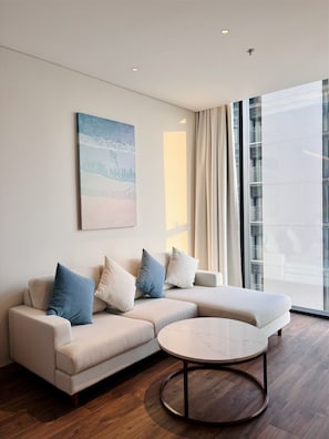 Standard Apartment | Living area | 40-inch LCD TV with cable channels