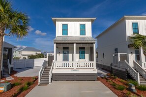 A two-story white building with a porch and a staircase leading to the entrance. - BVR 40 - Isle Be Back by Liquid Life (Orange Beach)