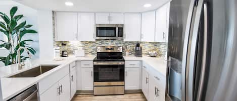 Condo, 2 Bedrooms | Private kitchen | Fridge, oven, coffee/tea maker, toaster