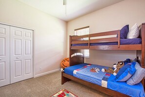 A bunk bed with a blue quilt and pillows, a basketball, and a stuffed toy. - Private Oasis With Pool & Spa- 3400clr 4 Bedroom Home by RedAwning (Kissimmee)