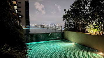 2 outdoor pools, open 7:00 AM to 10:00 PM, pool loungers