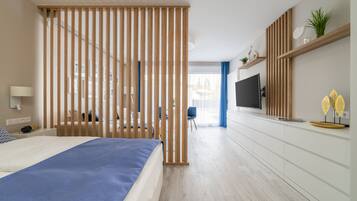 Premium Apartment | Living area | 100-cm flat-screen TV with cable channels