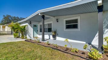 Stunning home with a beautifully landscaped garden and inviting front porch.