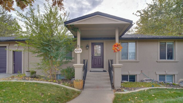 A two-story house with a front porch, a welcome sign, and a front door. - Kaysville Group Getaway 26 Mi to Snowbasin Resort! (Kaysville)