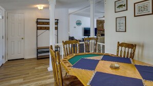 A dining area with a wooden table, chairs, and a pool table. - Prosperity Vacation Rental ~ 1 Mi to Lake Murray! (Prosperity)
