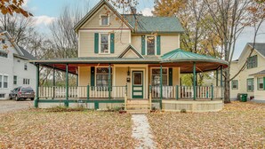 A two-story house with a porch and a covered area. - Eau Claire Retreat: Close to Campus & Dtwn! (Eau Claire)