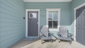 A house with a dark gray door, a mailbox, and a number 7620 on the wall. - 3 Bed 2 Bath house Chasing Sunsets Sleeps 7 (panama city beach)