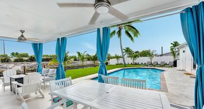 Waterfront Tropic Oasis: Heated Pool, Pergola, Canal, Dock, Air Hockey!