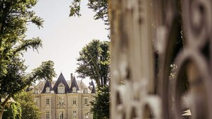 A grand chateau with a symmetrical facade, a central entrance, and a well-maintained garden. - Château de la Grange Moreau (Vallon-sur-Gée)