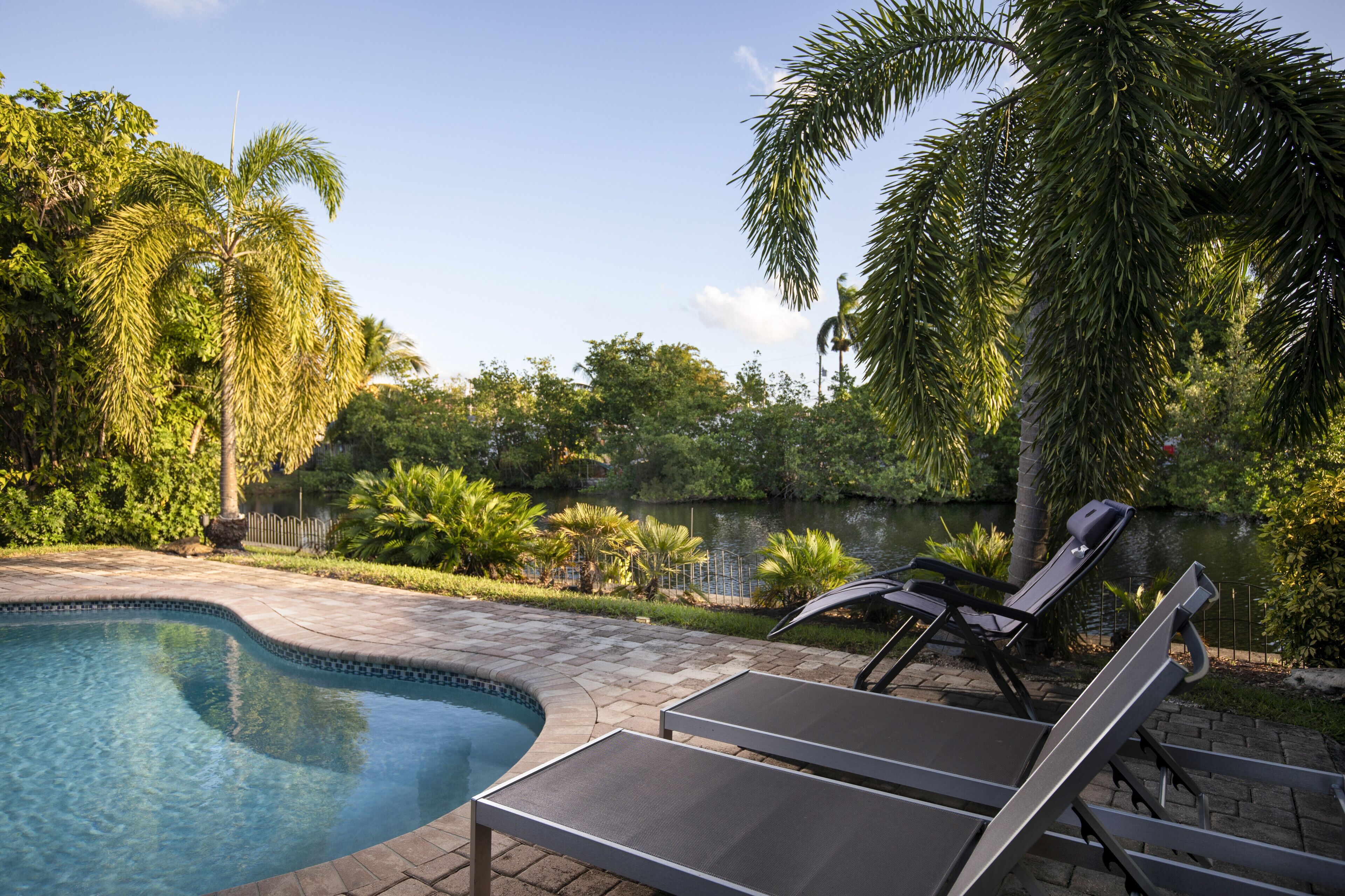Stunning & Private 5 BDR Canal-Front Home w/ Pool – Minutes to the Beach!