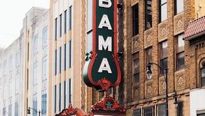 A theater marquee with the name "ALABAMA" in large letters.