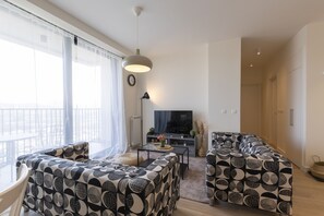 独特公寓 | 起居区 | 50-英寸纯平电视(配备有线频道)