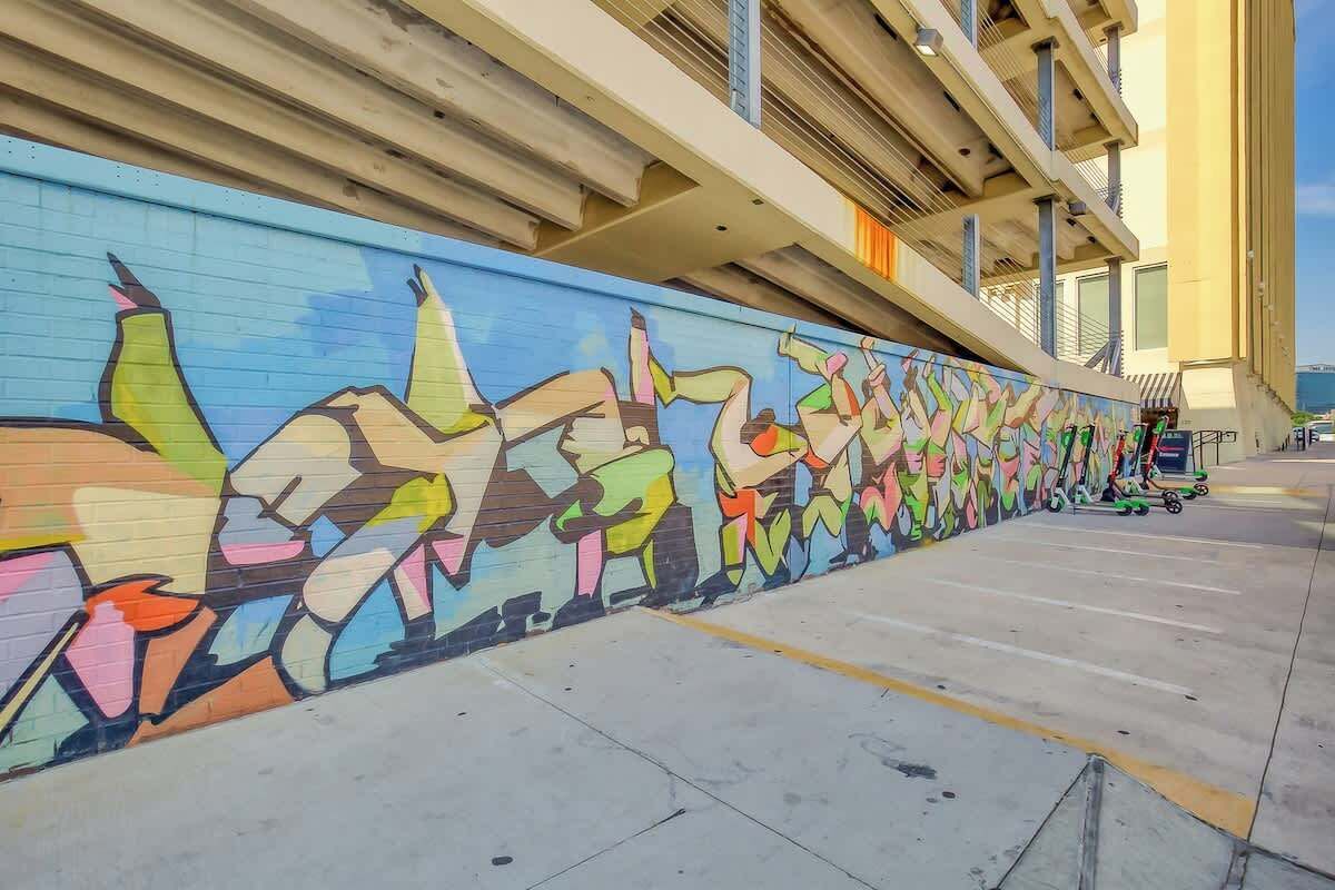 A colorful mural on a building's exterior wall.