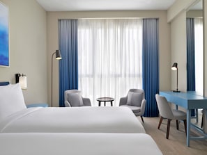 Premium bedding, down comforters, pillowtop beds, minibar