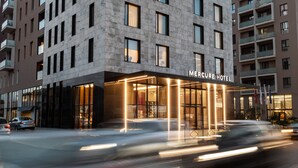 A modern hotel with a prominent entrance, multiple floors, and a clear sign reading "Mercure Hotel". - Mercure Tirana (Tirana)