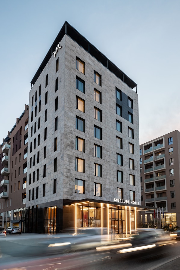 A modern hotel with a prominent entrance, multiple floors, and a clear sign reading "Mercure Hotel". - Mercure Tirana (Tirana)