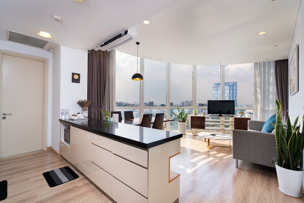 2 BEDROOMS APARTMENT | Living area | 45-inch Smart TV with cable channels, Netflix, pay films - Tracy Ben Thanh Tower (Ho Chi Minh City)