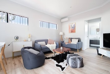 This cosy corner is ideal for unwinding, with soft furnishings and a welcoming atmosphere.