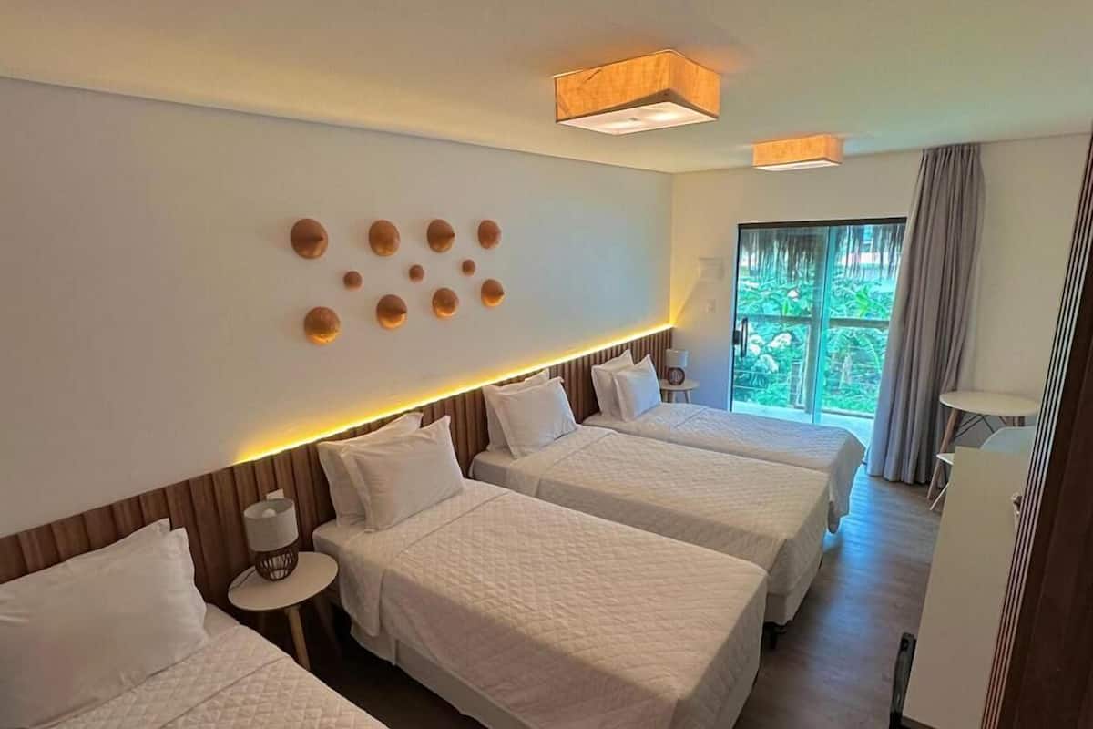 Comfort Quadruple Room | Minibar, in-room safe, blackout drapes, iron/ironing board