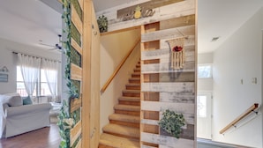 A staircase with wooden steps and a decorative wall. - Scenic Canyon Lake Vacation Home Near Boat Ramp! (Canyon Lake)