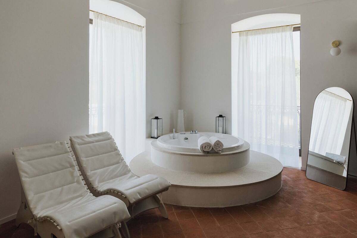 Suite, 1 King Bed, Hot Tub, Sea View | Bathroom | Separate tub and shower, deep soaking tub, rainfall showerhead